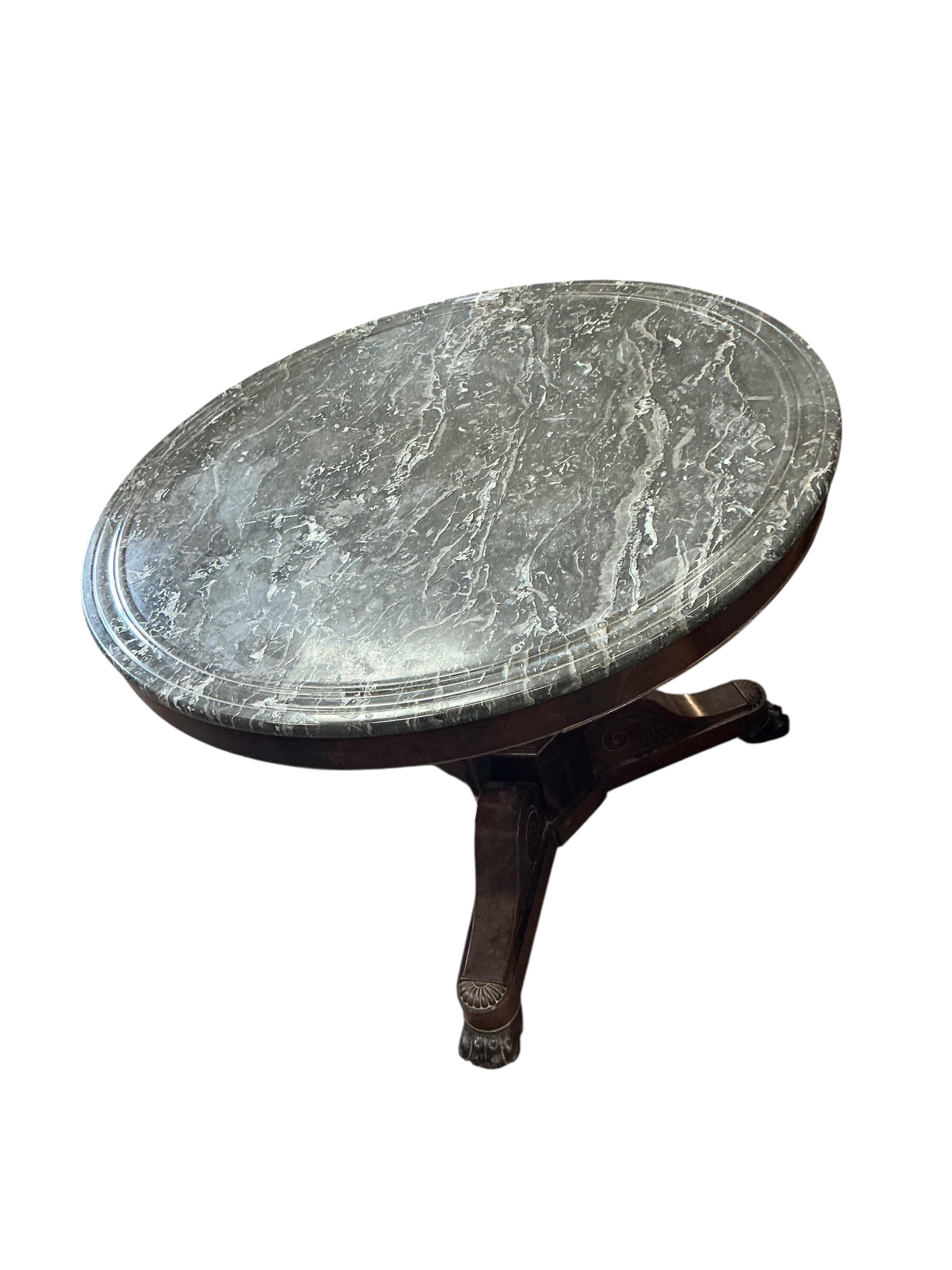 A French Empire circular marble top mahogany centre table, diameter 98cm, height 77cm